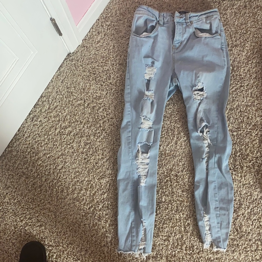 Distressed light color skinny jeans